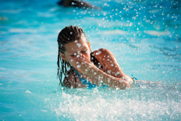 istock Girl plays in the pool 108222301