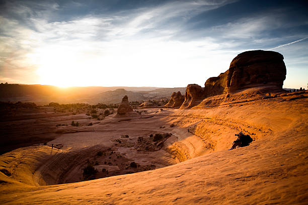 A stunning sunset over a ridge in silhouette.