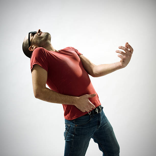 Young man playing air guitar