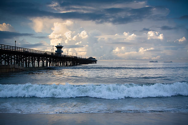 Seal Beach Pier with Stormy Skies and Waves stock photo