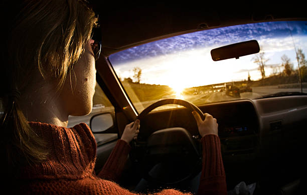 istock Woman Driving a Car At Sunset 108222518