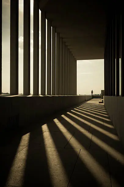 Photo of Building Columns Shadows in Hallway