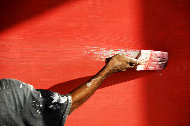 istock Man's Hand Painting Wall Red 108222783