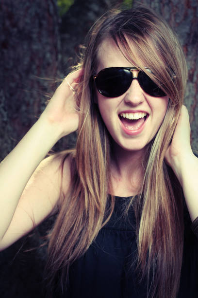 Young Woman Wearing Sunglasses and Having Fun stock photo