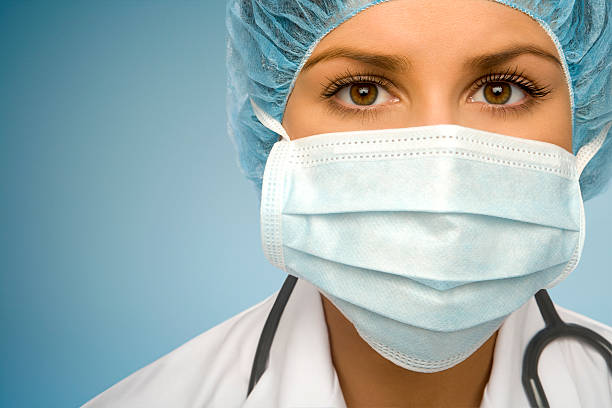 Woman Doctor Examining You stock photo