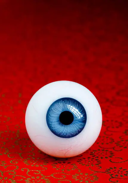 fake eyeballs on a red paper