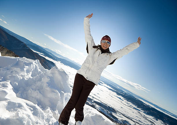 Young caucasian woman skier . Winter sports and leasure activities