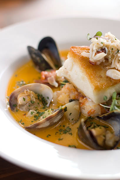 A fish stew with clams, mussels, shrimp in tomato sauce stock photo