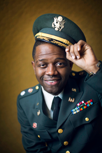A portrait of a decorated United States military man, in full dress uniform with a pleasant smile.  His lapel indicates he is an engineer.