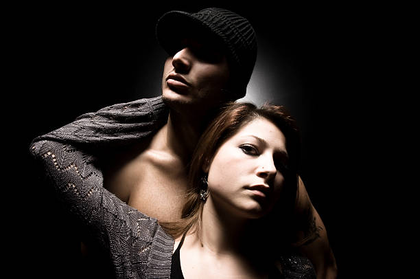 istock ShirtlessYoung Man Standing Behind Young Woman Posing 108223803