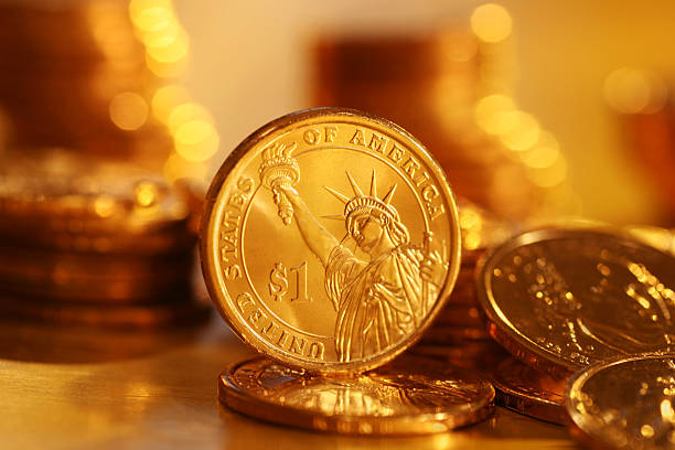 istock American Gold Dollar Coins Stacked 108223859