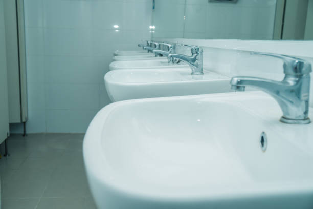 istock line of washbasin in public restroom 1082239140
