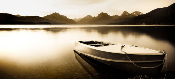 calma barco a remo no lago de montanha, sépia - rowboat sepia toned nautical vessel montana - fotografias e filmes do acervo