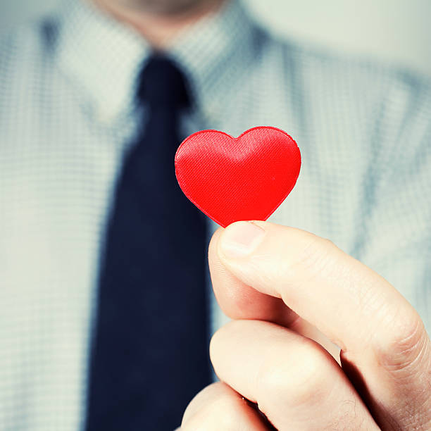 istock Man Holding Small Heart Shaped Cut-out 108224200