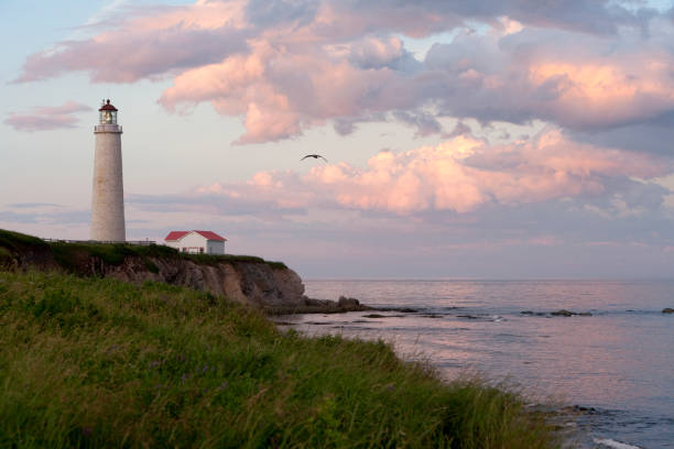 Sunset On Cap-des-Rosiers Lighthouse Beautiful Sunset On Cap-des-Rosiers Lighthouse, Gaspesie, Quebec, Canada. http://02b5b0c.netsolhost.com/stock/banniere8.jpg forillon national park stock pictures, royalty-free photos & images