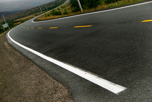 Single white line on asphalt top view. Road markings, one stripe on roadside outdoors, close-up.