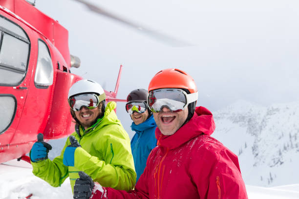 Small group heli skiing stock photo