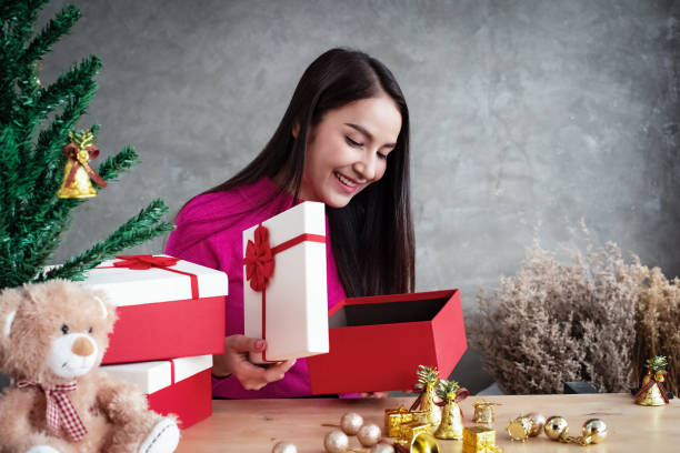 istock The beauty lady opened gift box,looking inside with smile and happy face 1082251064