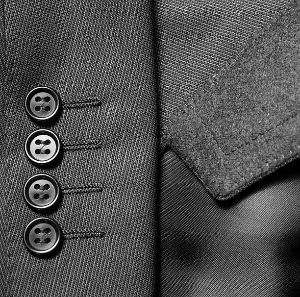 クローズアップのスーツジャケットのボタン - dressed in suit ストックフォトと画像