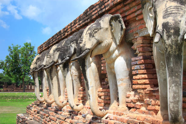 istock Elephants surrounded pagoda Wat Sorasak temple in Sukhothai 1082255546