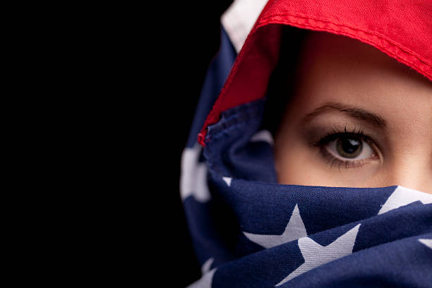 istock Woman's face wrapped in an American Flag 108225581