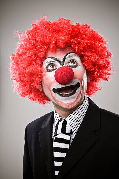 geschäftsmann clown - clownsnase stock-fotos und bilder