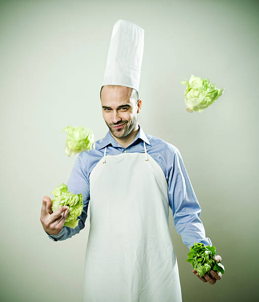 portrait of asian Smiling chef. Isolated over white background. Gourmet.