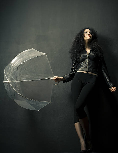 Young Woman Posing with Clear Umbrella