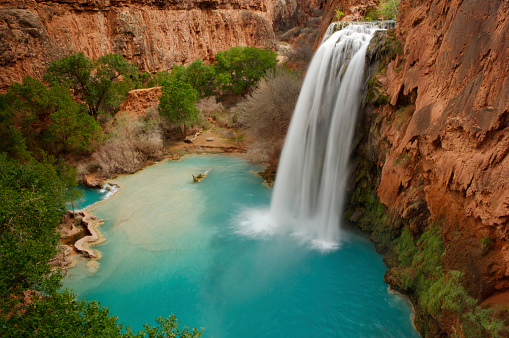 Stunning view from a flowing waterfall into the canyon.