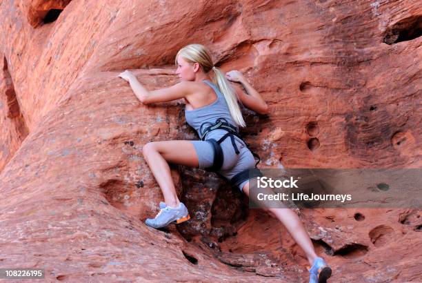Young Woman Rock Climbing Stock Photo - Download Image Now - Gripping, Mountain Climbing, Adult