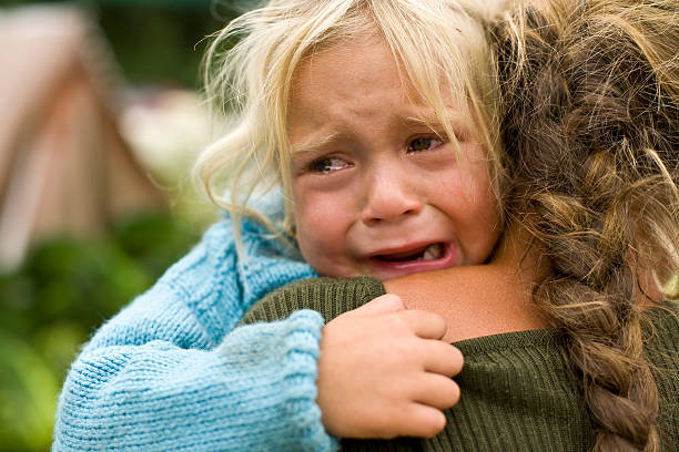 Girl crying  family mother poverty sadness stock pictures, royalty-free photos & images