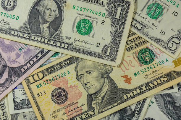istock Background of different american dollar banknotes 1082262438