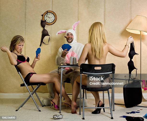 Two Women And Man Playing Strip Poker Stock Photo - Download Image Now - Easter, Sensuality, Playing Card