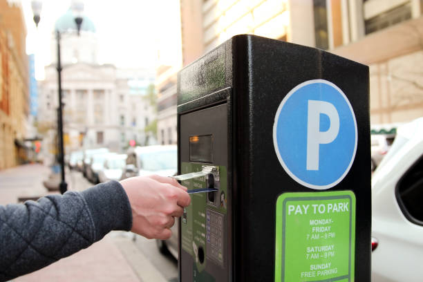 istock man is paying his parking using credit card at  parking pay station terminal 1082268206