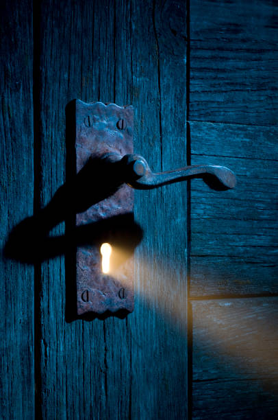 istock Mysterious Light Coming Through Antique Keyhole and Door 108226900