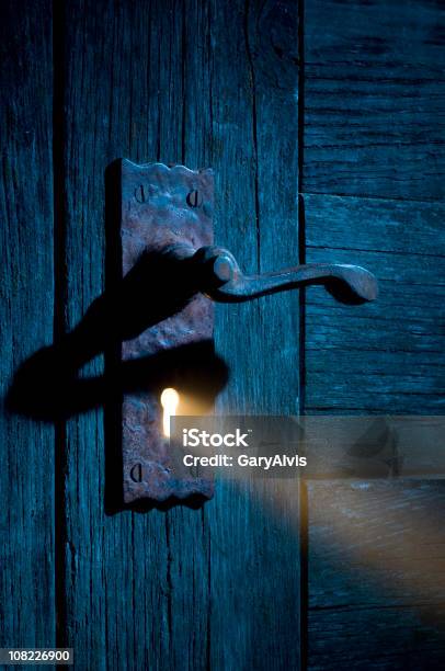 Mysterious Light Coming Through Antique Keyhole And Door Stock Photo - Download Image Now