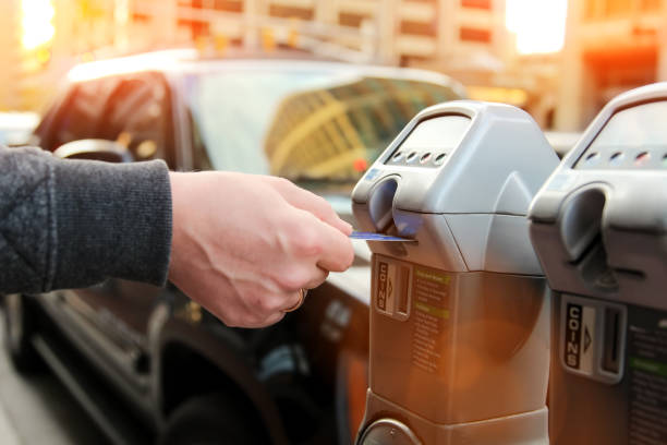 istock man is paying his parking using credit card at  parking pay station terminal 1082269224