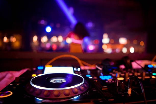 DJ sound equipment at nightclubs and music festivals, EDM, future house music and so on. Parties concept, sound technique. DJ playing on the best, famous CD players. stock photo