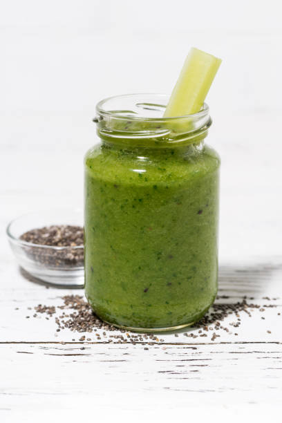 istock healthy green fruit and vegetable smoothies with chia seeds on white table 1082279142