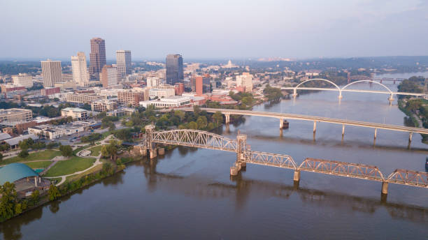 The River is Wide Flowing Past The Arkansas State Capitol City stock photo