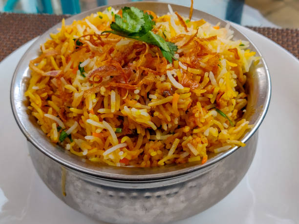 istock Dum Biryani served in a steel pot. Top view 1082284646