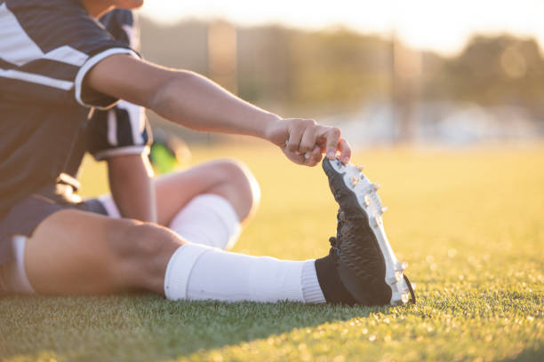 istock Soccer teammates stretching out before a match 1082287304