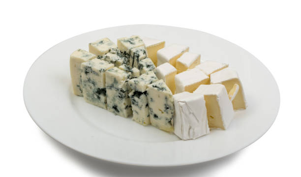 istock Piece of Blue Cheese and White Cheese on Plate Isolated 1082289786