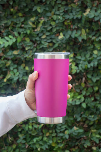 istock Hand on stainless steel tumbler mug 1082291278