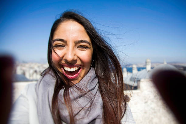 istock Beautiful woman taking selfie 1082295054