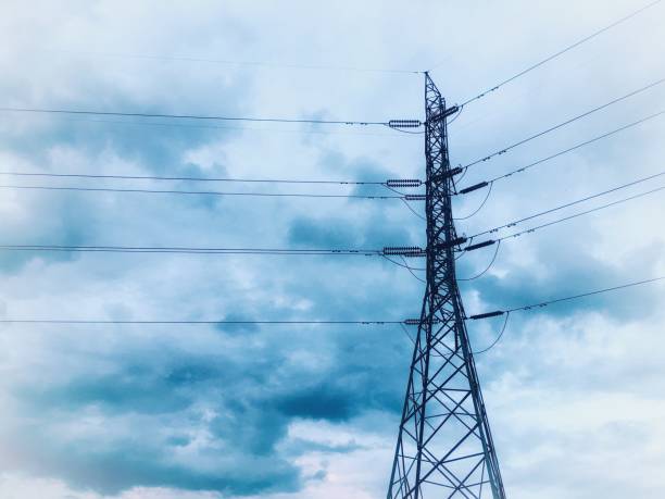 istock high voltage electric power pole under blue cloud. image adjust like watercolor  painting 1082299686