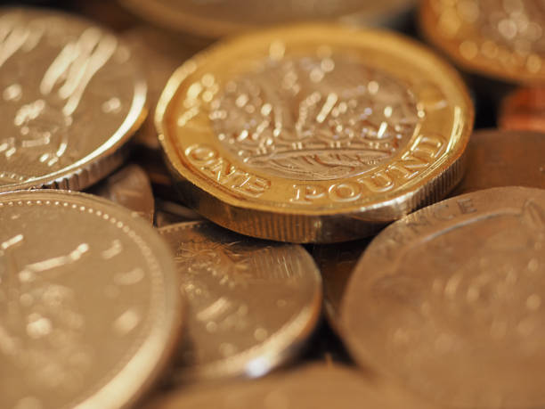 istock Pound coins, United Kingdom background 1082302214