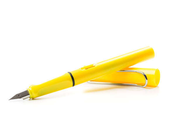 yellow modern fountain pen isolated on white, close up