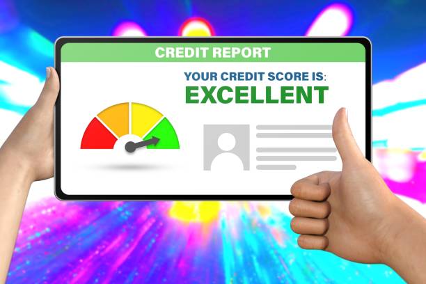 istock hand with tablet computer shows like, thumb up   on neon city lights background - excellent credit score technology concept 1082306636