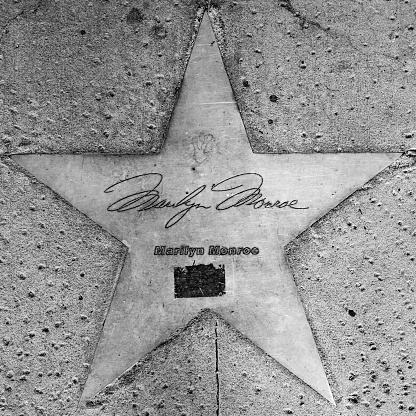 PHOENIX, USA - June 14, 2012: The name of stars in copper reflect the past glory of the Hotel San Carlos  in Phoenix, USA. The stars in the sidewalk were put in in 1993 to commemorate the visits of luminaries of their day.